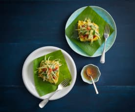 Steamed sea bass wrapped in banana leaves with green mango salad