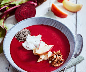 Pink smoothie bowl with coconut and pecans