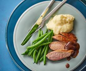 Duck breasts with orange ginger sauce, mashed potatoes and green beans