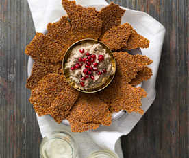 Linseed crackers with mutabbal beitinjan (eggplant dip)