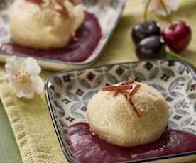 Dumplings with chocolate centres and cherry sauce