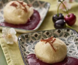 Dumplings with chocolate centres and cherry sauce