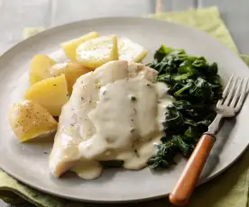 Steamed smoked haddock with new potatoes and spinach