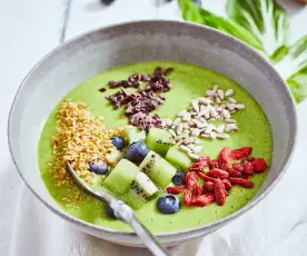 Green smoothie bowl with seeds and berries