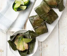 White fish wrapped in banana leaves