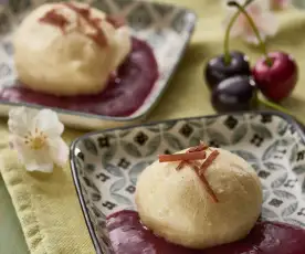 Dumplings with chocolate centres and cherry sauce