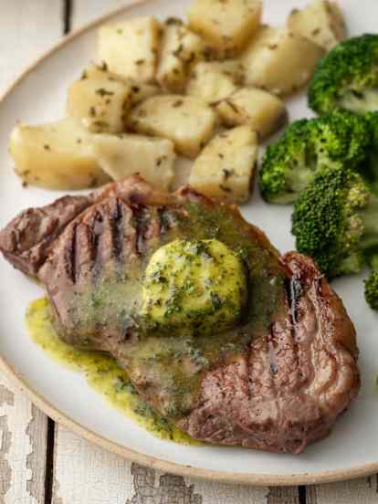 Sirloin Steaks and Herb Butter with Rosemary Potatoes and Broccoli