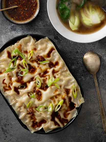 Layered wonton lasagne, chicken broth, spicy sauce