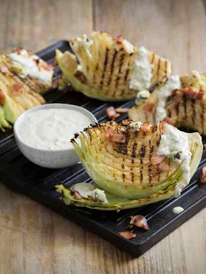 Grilled cabbage with blue cheese dressing and bacon