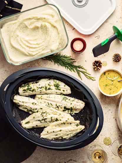 Bisque de crevettes à l'orange, bar aux herbes et purée de panais