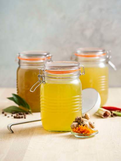 Turmeric and ginger-infused chicken broth