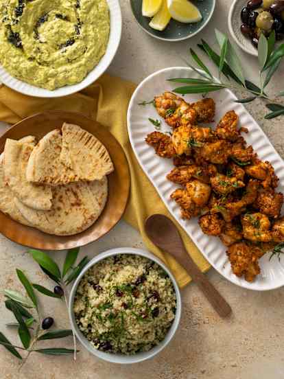 Mezze spread: eggplant dip, bulgur salad, harissa grilled chicken