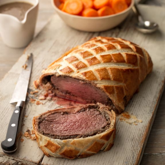 Beef Wellington With Mashed Potatoes, Steamed Carrots And Madeira Sauce 