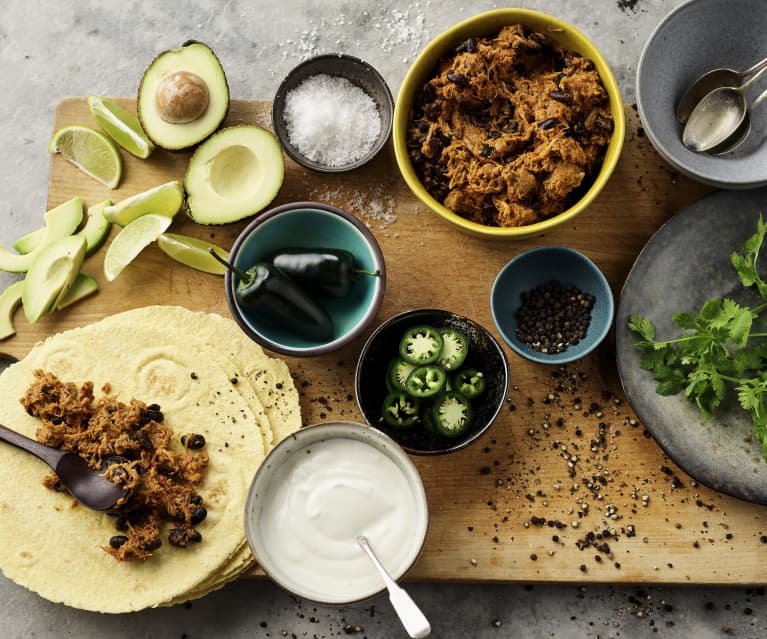 Tex-Mex tortillas with shredded pork and black beans