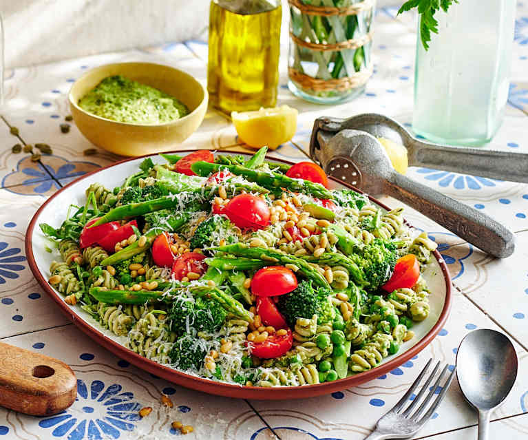 Layered veggie-loaded pesto pasta