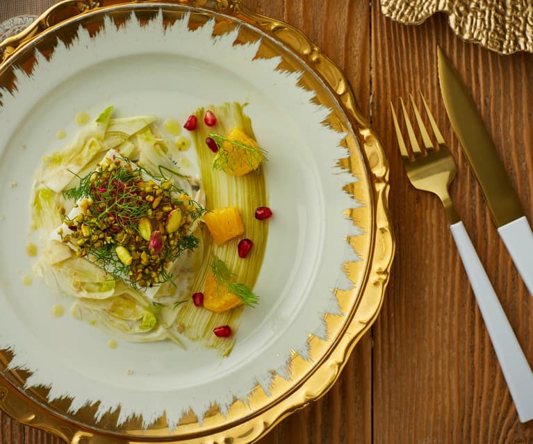 Baccalà in crosta di pistacchi, olio agli agrumi finocchi e melagrana