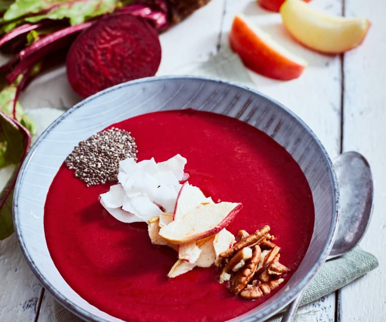Pink smoothie bowl with coconut and pecans
