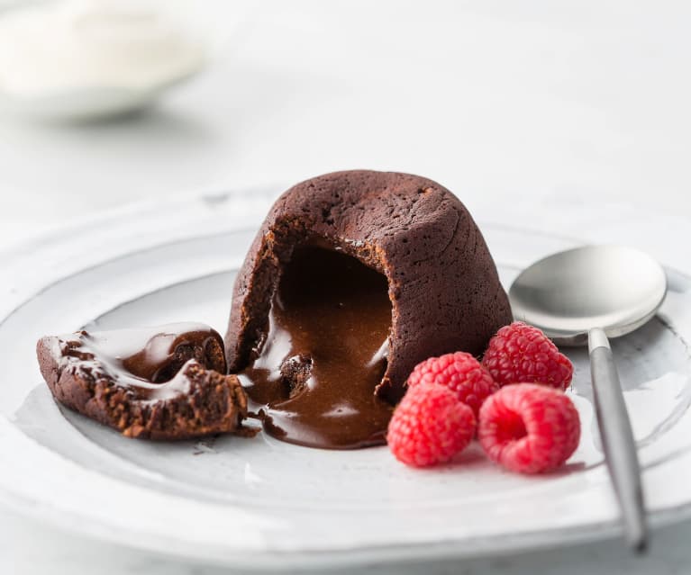 Chocolate cake volcano with creamy ice cream and strawberries Stock Photo -  Alamy