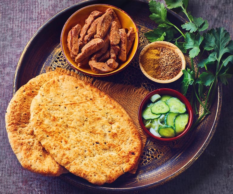 Filetto di maiale con salsa speziata al cocco e pane naan all'aglio