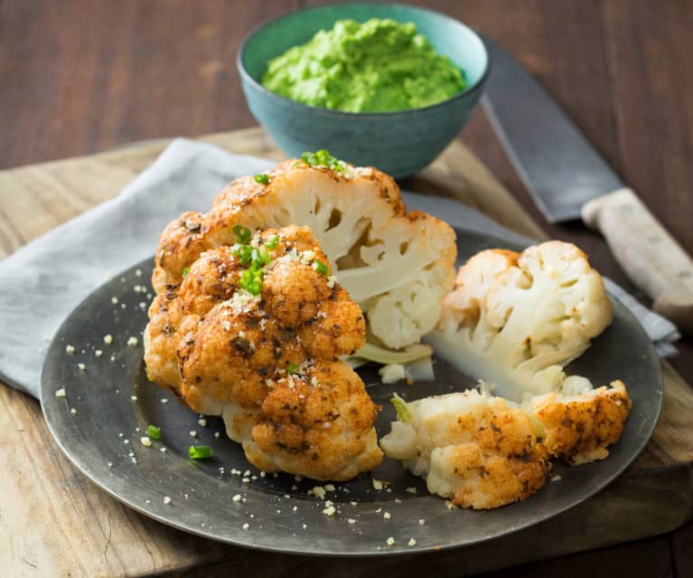 Whole cauliflower with pea purée