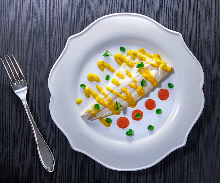 Branzino alle erbe aromatiche con salsa all'arancia Branzino alle erbe aromatiche con salsa all'arancia