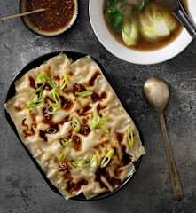 Layered wonton lasagne, chicken broth, spicy sauce