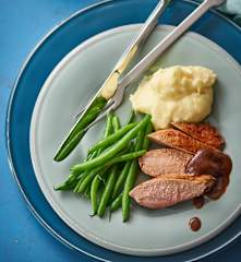 Duck breasts with orange ginger sauce, mashed potatoes and green beans