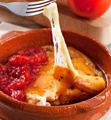 Tomate confitado con queso provolone