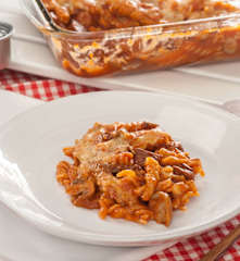 Fusilli con calamares en salsa americana y champiñones