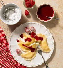 Cream cheese pierogi with raspberry sauce