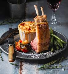 Lamb rack with roasted ratatouille, garlic green beans and potato gratin