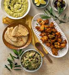 Mezze spread: eggplant dip, bulgur salad, harissa grilled chicken